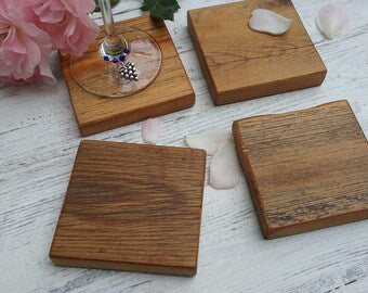 4 rustic coasters with wine glass on on top left one