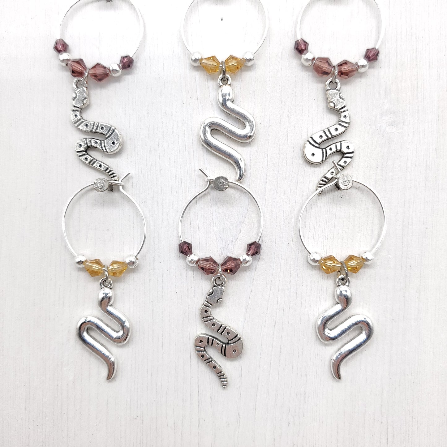 six snake wine charms with crystal beads and silver spacings