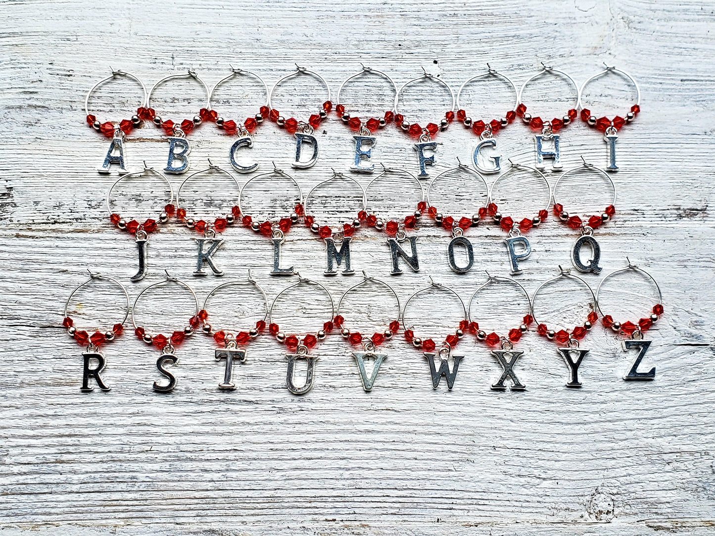 set of 26 alphabet wine charms with red crystal beads