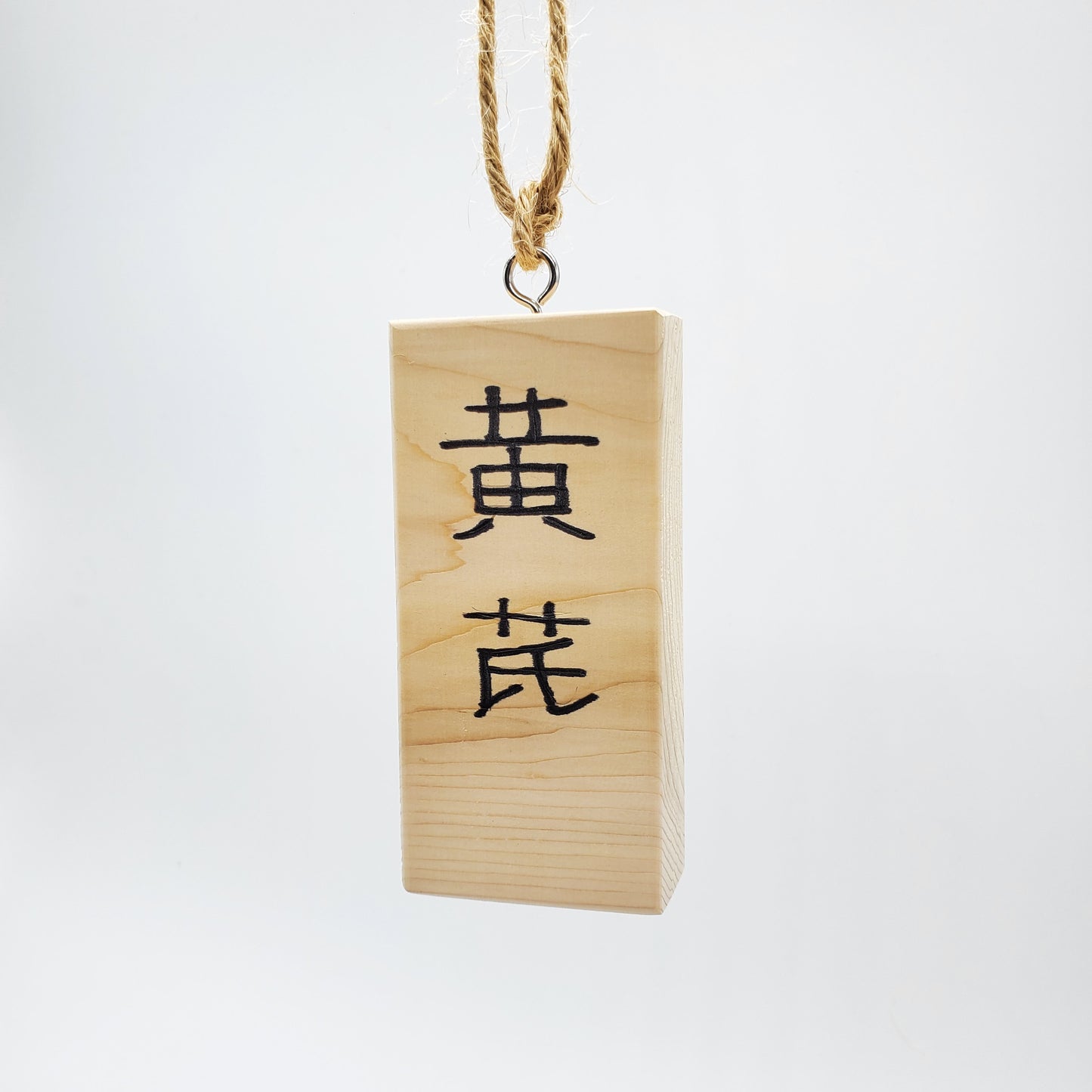 Cedar wood marker with plant astragalus name written in Chinese