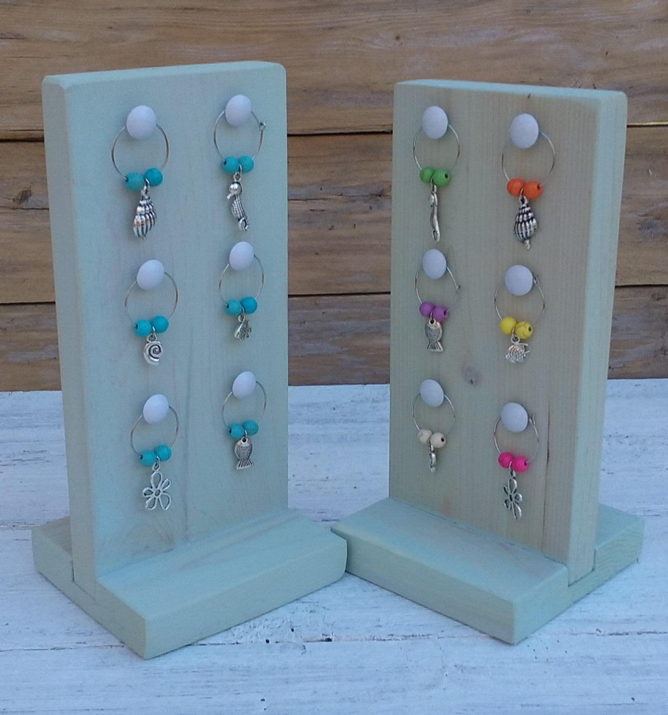 2 washed turquoise wooden stands with nautical wine charms