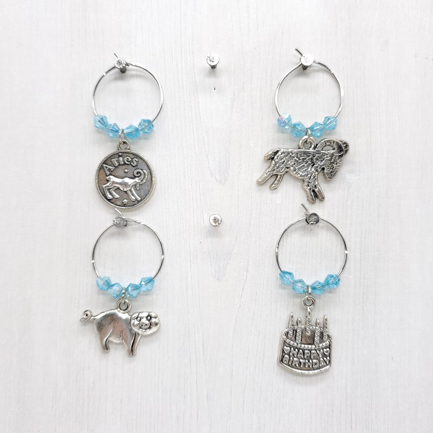 set of 4 Aries birthday wine charms year of pig with pale blue crystal beads