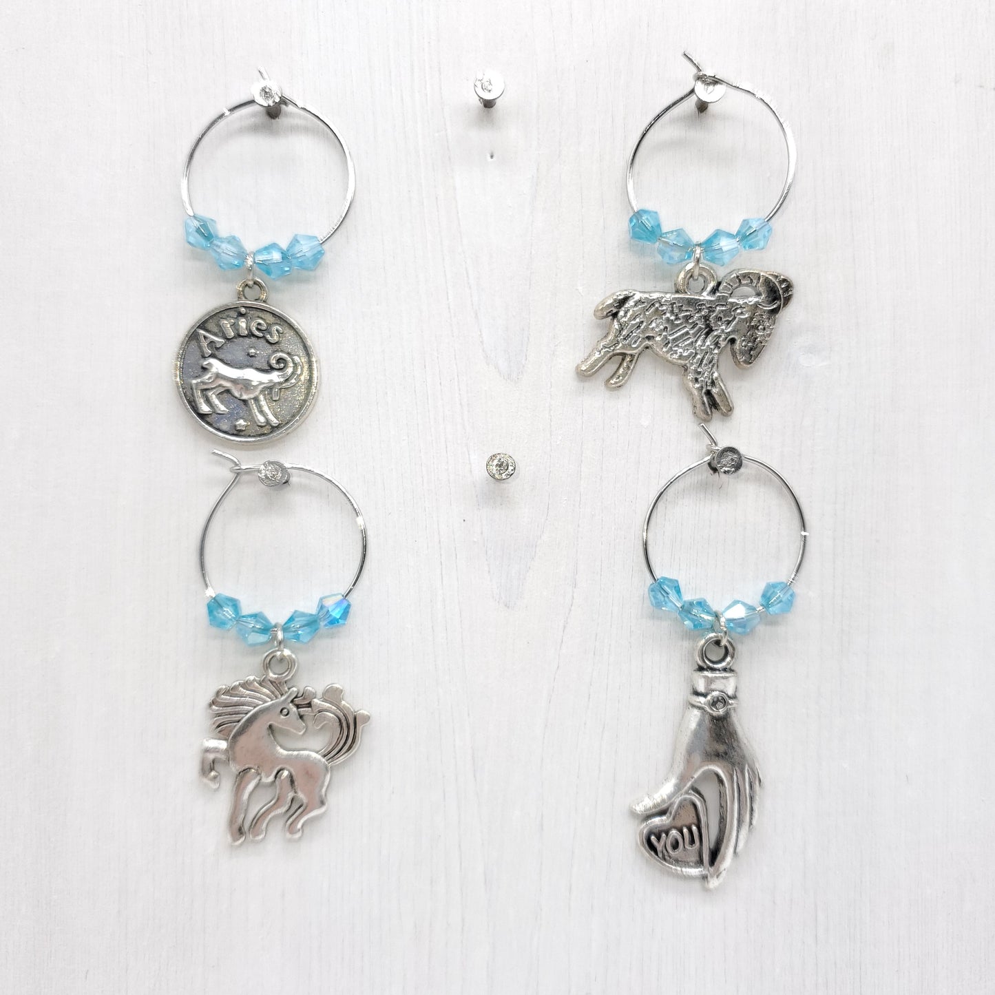 set of 4 Aries birthday wine charms year of horse with pale blue crystal beads